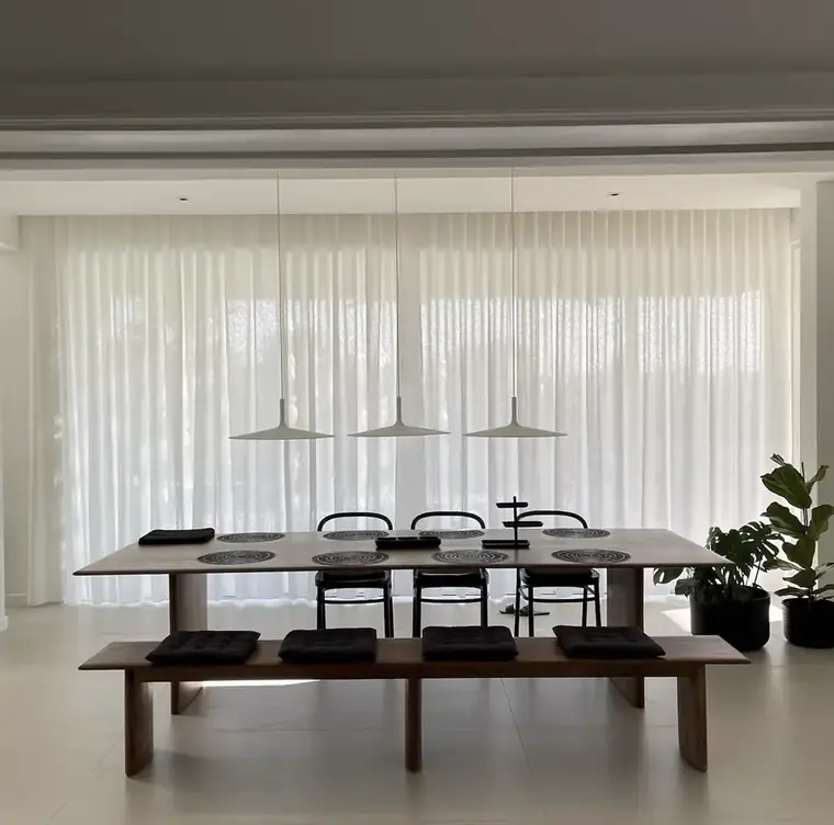 Dining room with sheer curtains